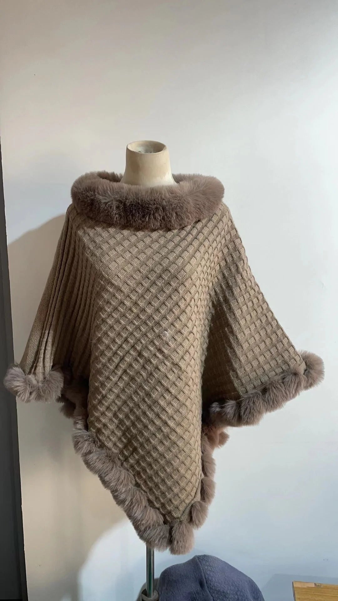 Luxurious rabbit fur wrap shawl in various colours, featuring a soft, cosy collar and a flattering cropped fit for a chic, polished look.