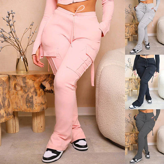 Versatile cargo trousers with pockets, high-waist design, and adjustable drawstring waistband for women