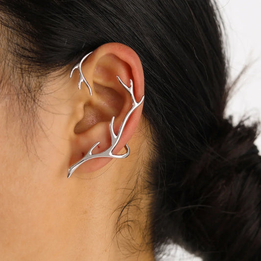 Vintage bone hypoallergenic elf earrings with geometric design in gold, silver, black, and green