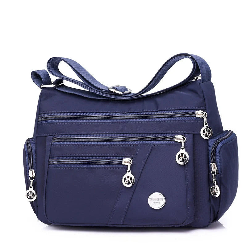 Ladies waterproof nylon oxford crossbody bag in various colors with multi-layer storage