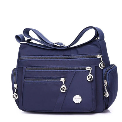 Ladies waterproof nylon oxford crossbody bag in various colors with multi-layer storage