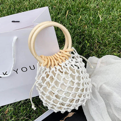 Stylish woven beach bag with wooden handle, perfect for summer outings