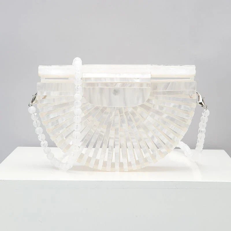Stylish acrylic cross-body bag in various colors and strap designs, perfect for everyday use and fashion-forward British style.