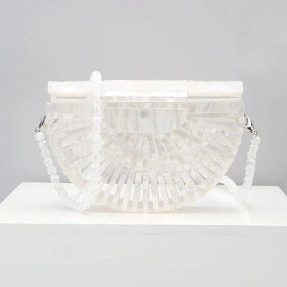 Stylish acrylic cross-body bag in various colors and strap designs, perfect for everyday use and fashion-forward British style.