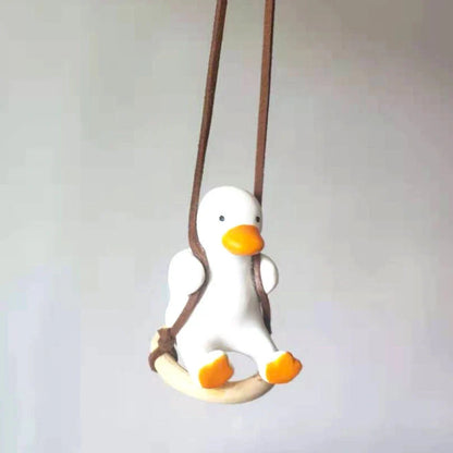 Car Swing Duck Ornament hanging from rearview mirror