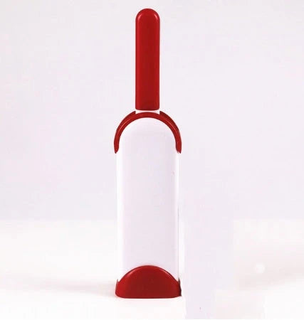 A reusable pet hair remover comb with a self-cleaning base, perfect for removing fur and lint from sofas, chairs, and other upholstery.