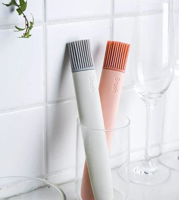 Premium silicone basting brush with sturdy, non-slip handle and flexible head for even distribution of sauces, oils, and glazes on meats, baked goods, and more.