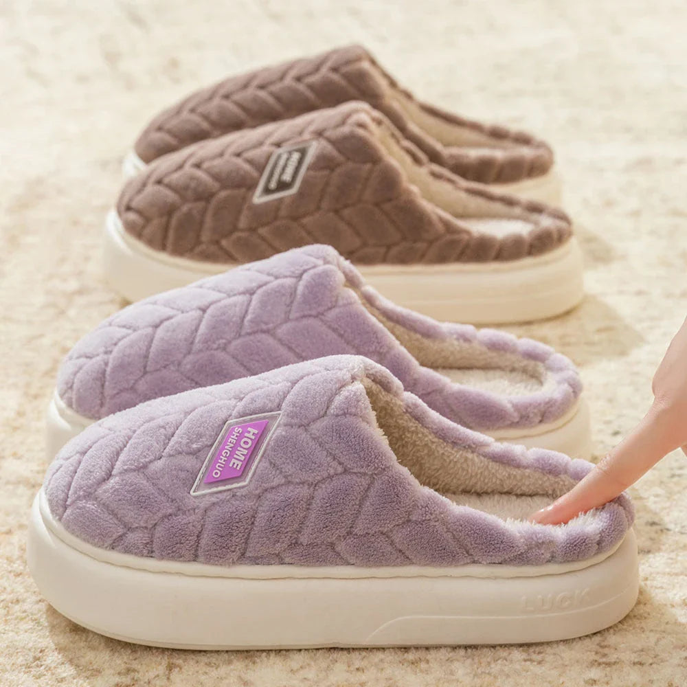 Cosy plush slippers in a variety of vibrant colours, featuring a soft fleece lining and durable non-slip sole for maximum comfort and stability.