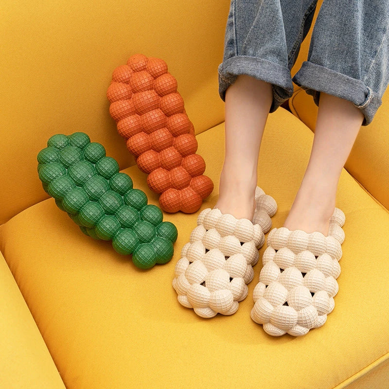 Comfortable massage bubble slides with breathable mesh upper and non-slip soles for indoor relaxation and pampering