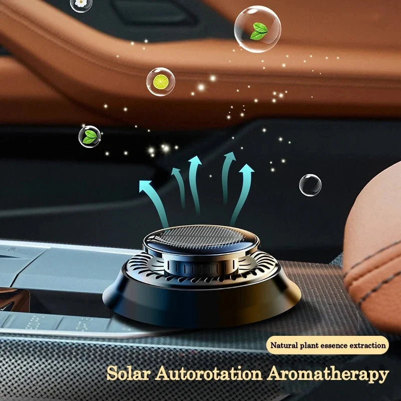 Solar-powered kinetic car air freshener with double ring rotation