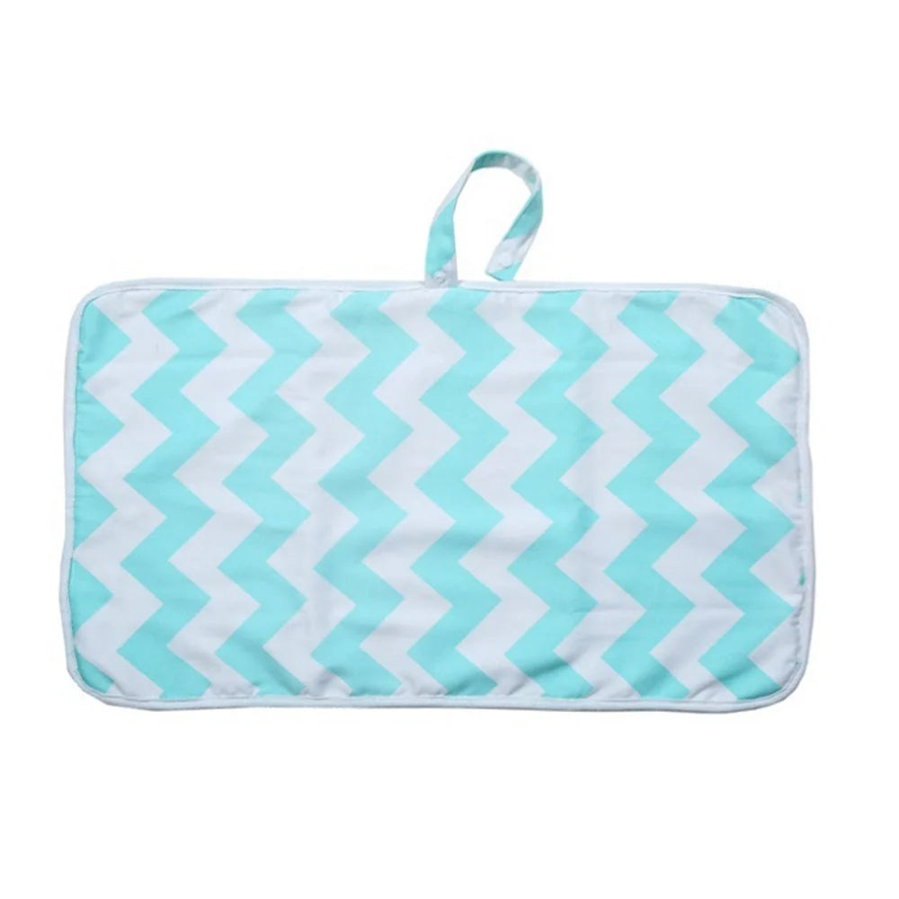 Portable diaper changing pad clutch with built-in toy ring, foldable design for easy transport