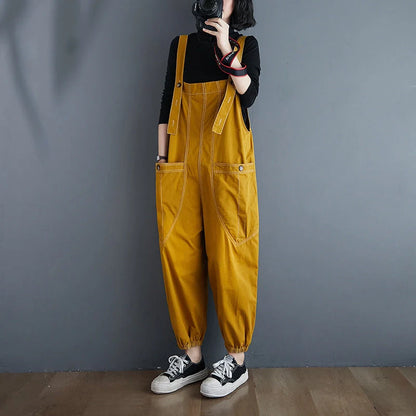Stylish plus-size black and yellow dungarees in a comfortable, fashionable design for the modern commuter
