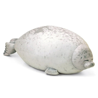 A plush, soft, and cuddly grey or white seal-shaped cushion with a detailed, lifelike design