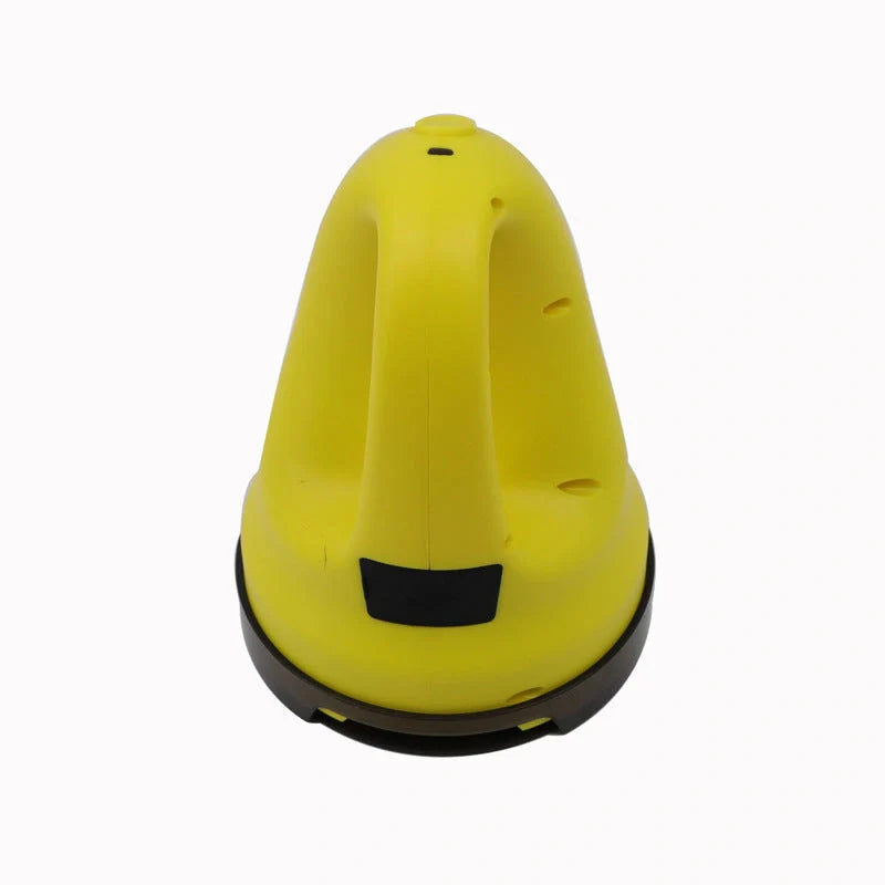 Electric snow scraper with yellow body and rotating disc for ice removal