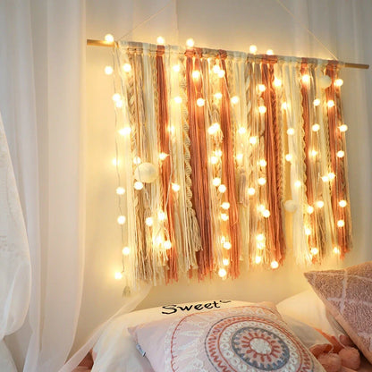 Battery-operated LED curtain garland with plastic stars and fur balls for festive decoration