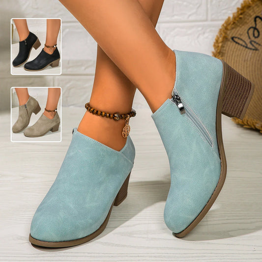Women's chunky heel ankle boots with side zipper in navy blue, black, and khaki