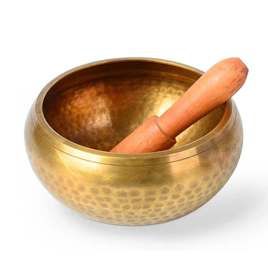 A handcrafted Tibetan singing bowl made of copper, used for meditation and relaxation.