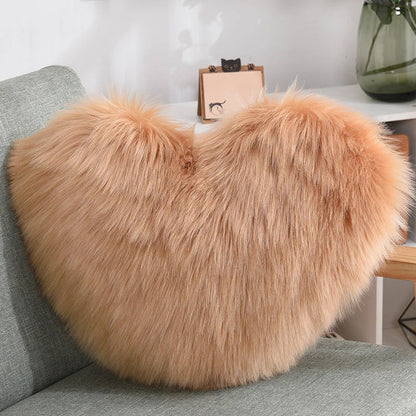 Cozy heart-shaped throw pillow with plush, shaggy texture in various colors
