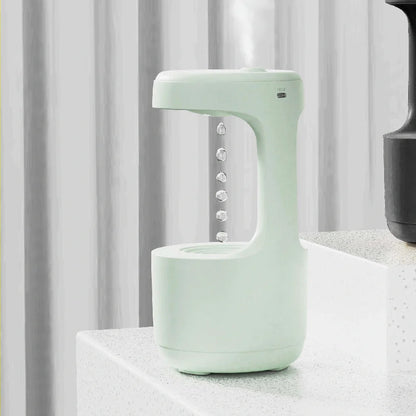 Anti-gravity humidifier with LED display and aroma diffuser in white, green, and black