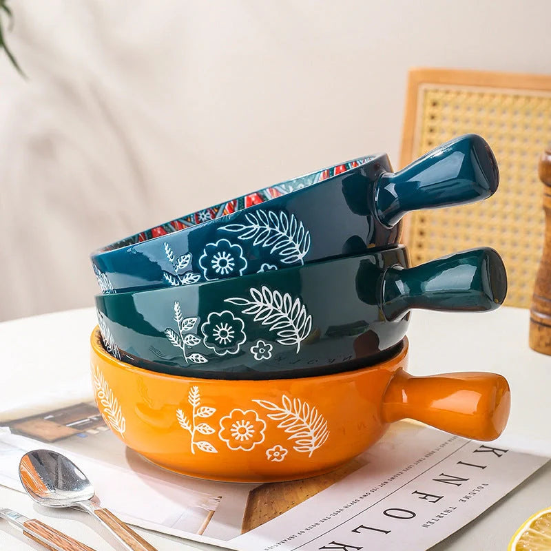 Set of elegant ceramic dessert bowls featuring hand-painted floral patterns in blue, red, and green glazes