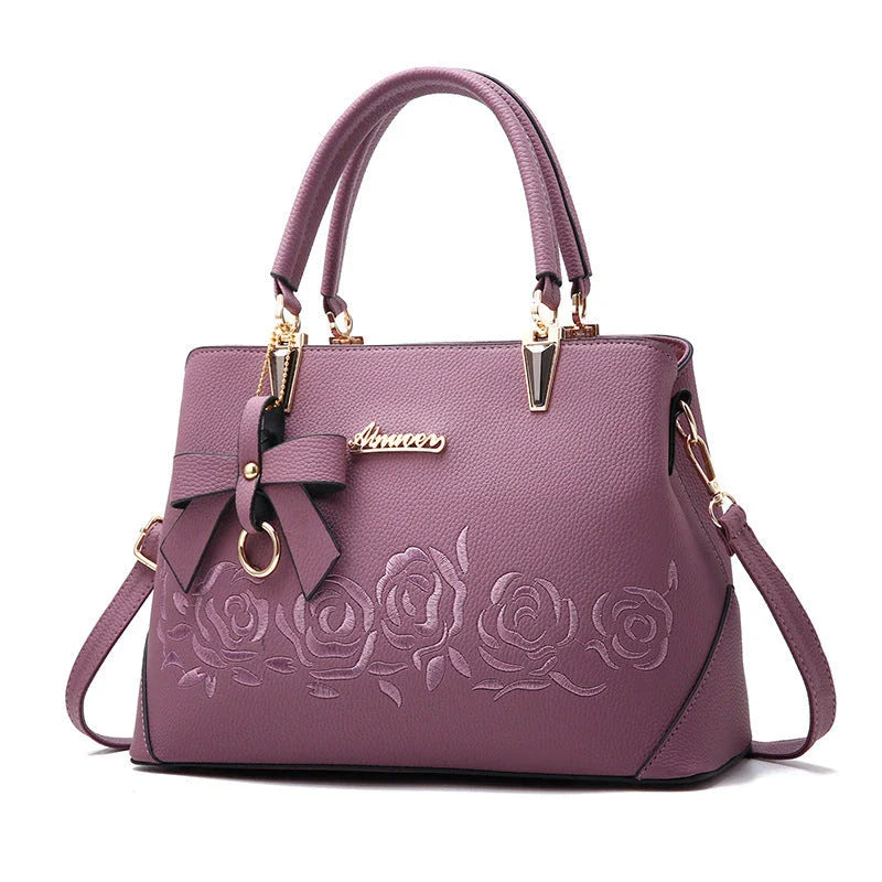 Stylish faux leather ladies' handbag in various colours, featuring a versatile single shoulder design and spacious interior