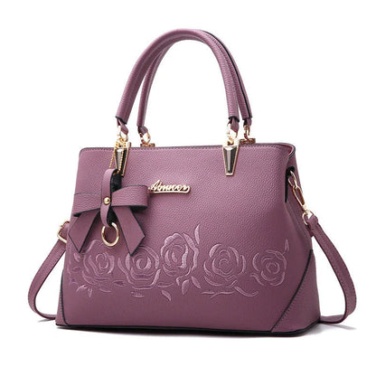 Stylish faux leather ladies' handbag in various colours, featuring a versatile single shoulder design and spacious interior