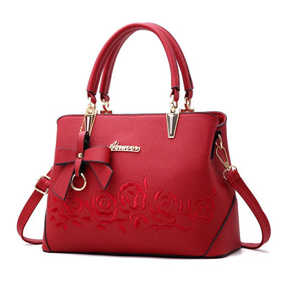 Stylish faux leather ladies' handbag in various colours, featuring a versatile single shoulder design and spacious interior
