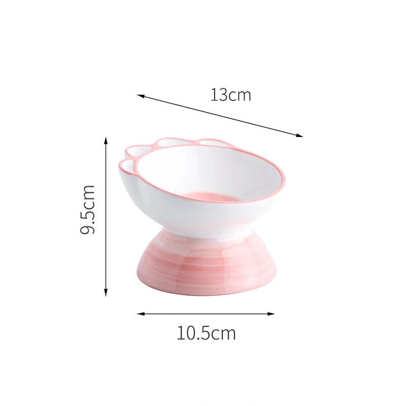 Ceramic pet bowl with 15-degree incline design in pink, green, and blue