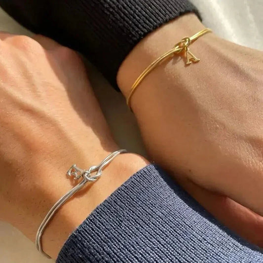Personalised gold and silver love knot bracelets for couples, perfect as Valentine's Day gifts.
