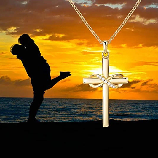 Elegant cross and infinity symbol pendant necklace in gold and silver tones, made with premium materials for a sophisticated and long-lasting accessory.