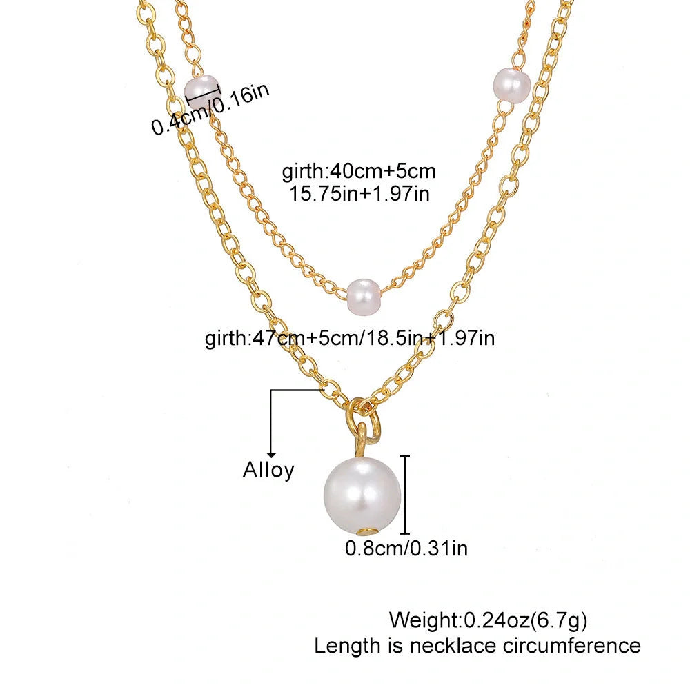 Elegant pearl and tassel double-layer necklace in gold tone, a timeless accessory for discerning women