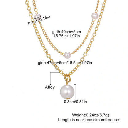 Elegant pearl and tassel double-layer necklace in gold tone, a timeless accessory for discerning women
