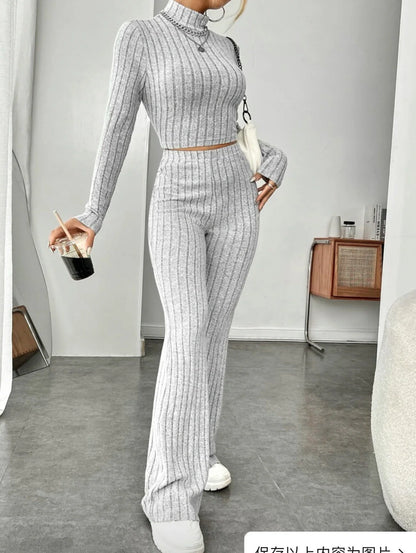 Elegant cotton turtleneck and wide-leg trousers suit in various colours, including bean green, light gray, dark red, and sapphire blue.
