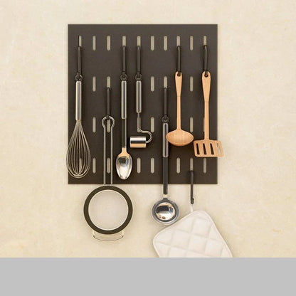A high-quality stainless steel wall-mounted kitchen storage rack with a perforated design for customisable storage