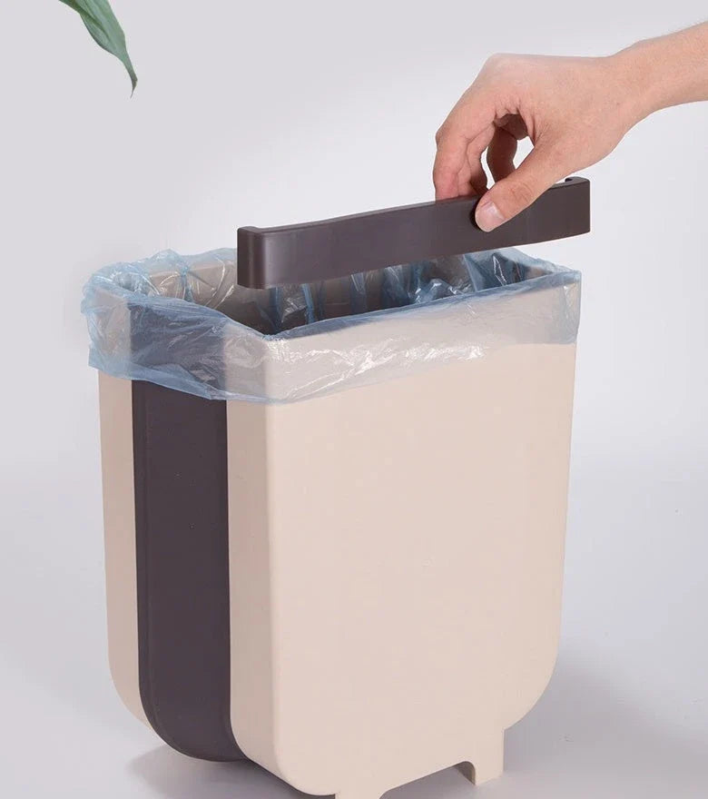 Foldable wall-mounted bin in brown and white colours, with a spacious 9-litre capacity and a sleek, space-saving design