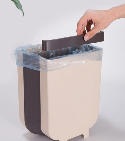 Foldable wall-mounted bin in brown and white colours, with a spacious 9-litre capacity and a sleek, space-saving design
