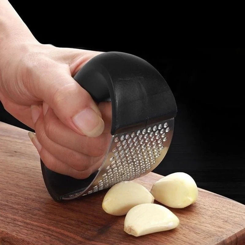 Stainless steel garlic press with ergonomic handle for easy mashing