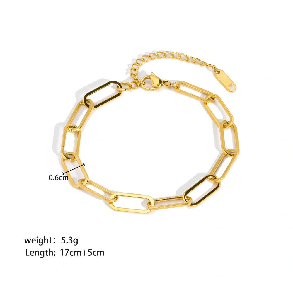 Stainless steel bracelet with real gold treatment in various colours, featuring geometry shapes and ring elements