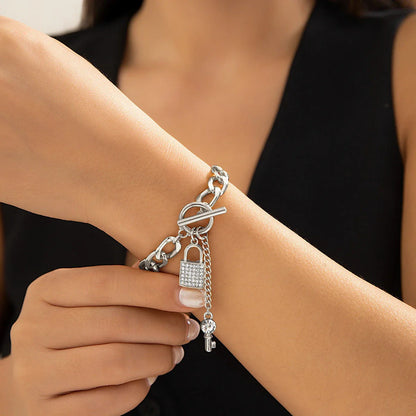 Elegant chain necklace and bracelet set with lustrous lock and key pendant for British ladies