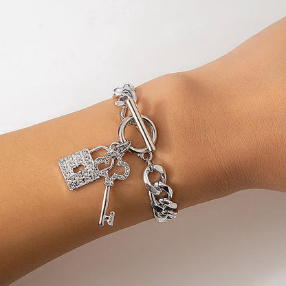 Elegant chain necklace and bracelet set with lustrous lock and key pendant for British ladies