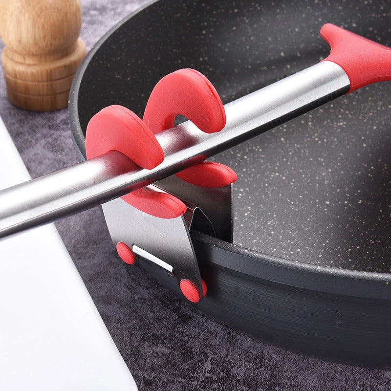 Premium stainless steel utensil holder with silicone lining and tilted design to prevent spills and keep cooking tools accessible