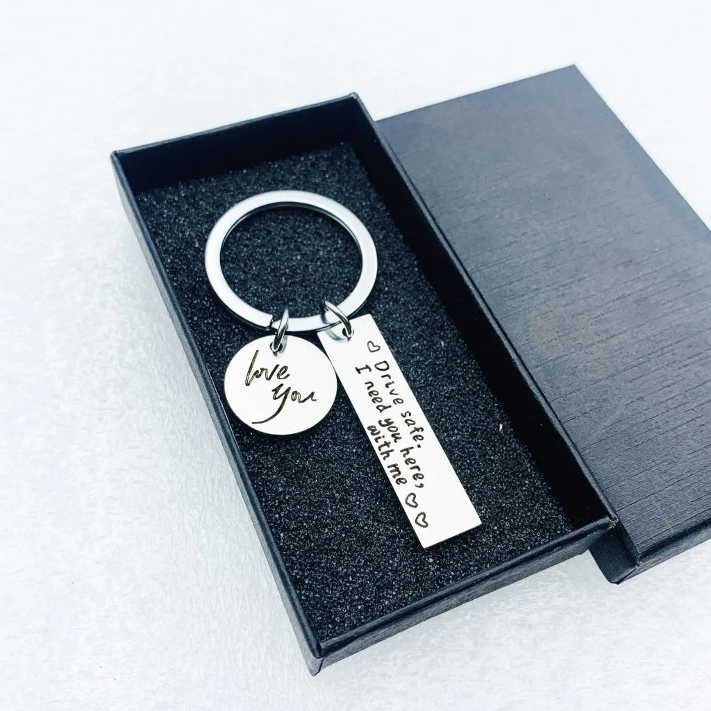 Unisex stainless steel safe driving keychain with elegant lettering