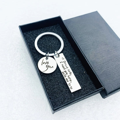 Unisex stainless steel safe driving keychain with elegant lettering