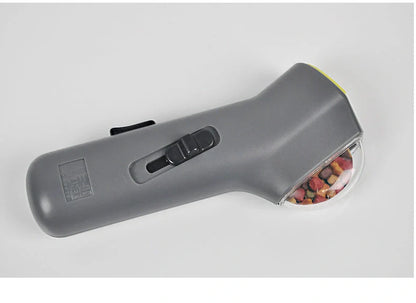 Dog Training Snack Launcher in grey, compact design for interactive pet play