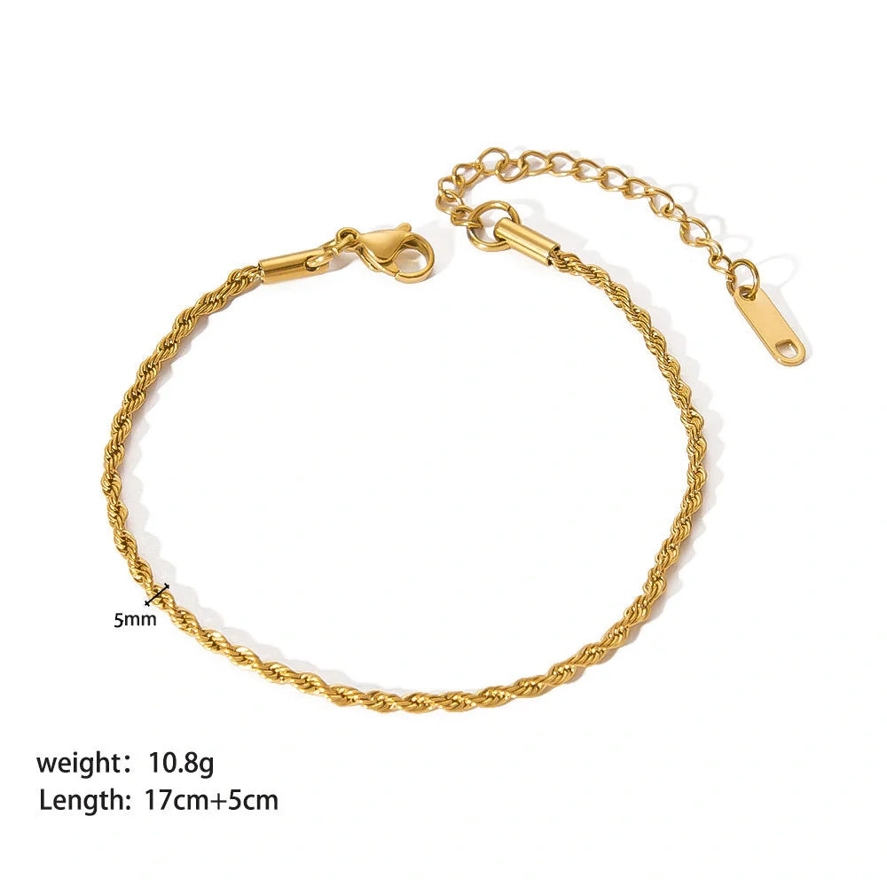 Stainless steel bracelet with real gold treatment in various colours, featuring geometry shapes and ring elements