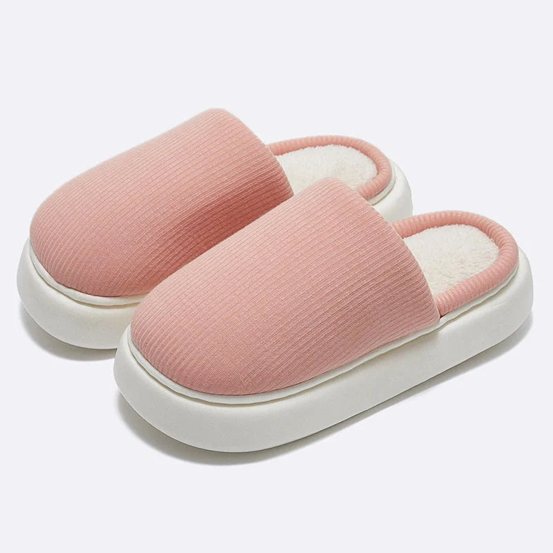 Cosy knitted fabric slippers in various colours and sizes, designed for couples to enjoy comfortable indoor relaxation.