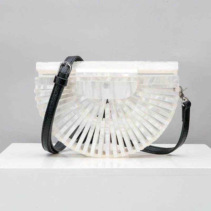 Stylish acrylic cross-body bag in various colors and strap designs, perfect for everyday use and fashion-forward British style.