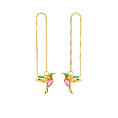 Elegant hummingbird drop earrings with crystal accents, a versatile fashion accessory for British women