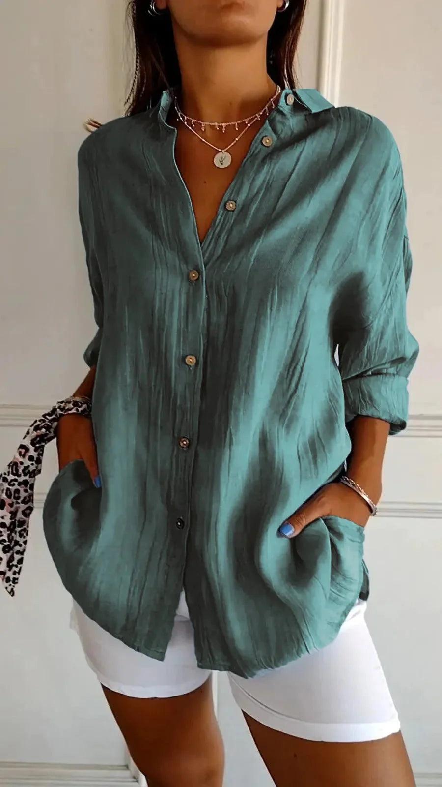 A stylish long-sleeved shirt with a pleated design, available in a variety of colours to suit any occasion.