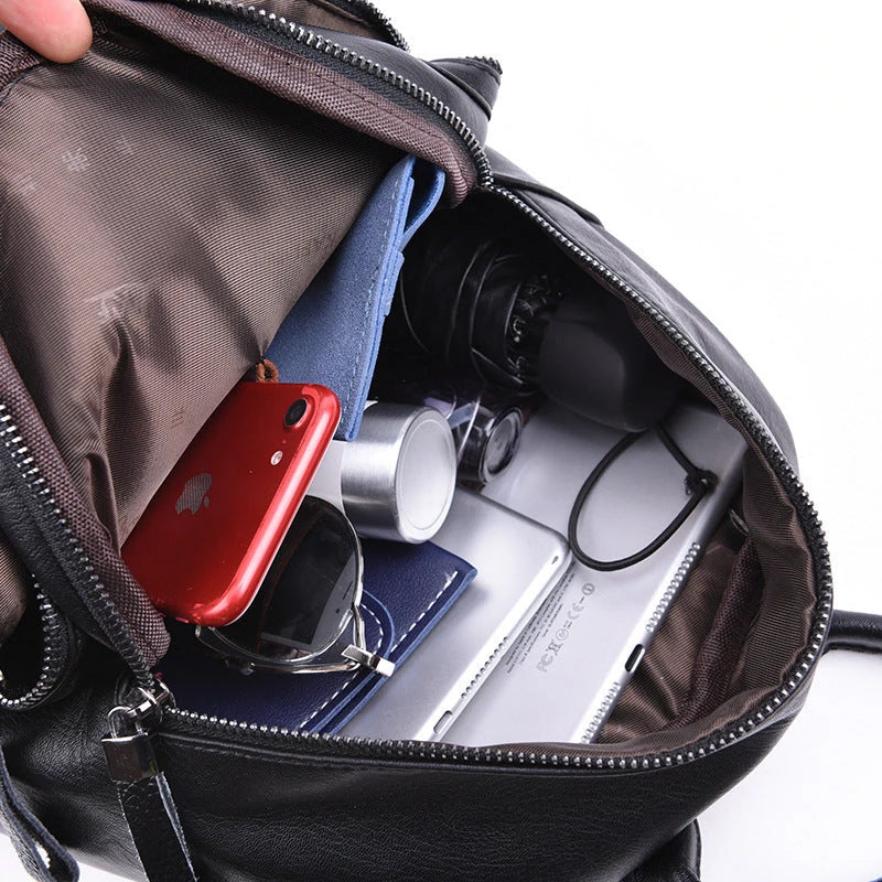 Stylish PU backpack in black, red, and blue colors with multiple compartments and adjustable straps for versatile and organized storage